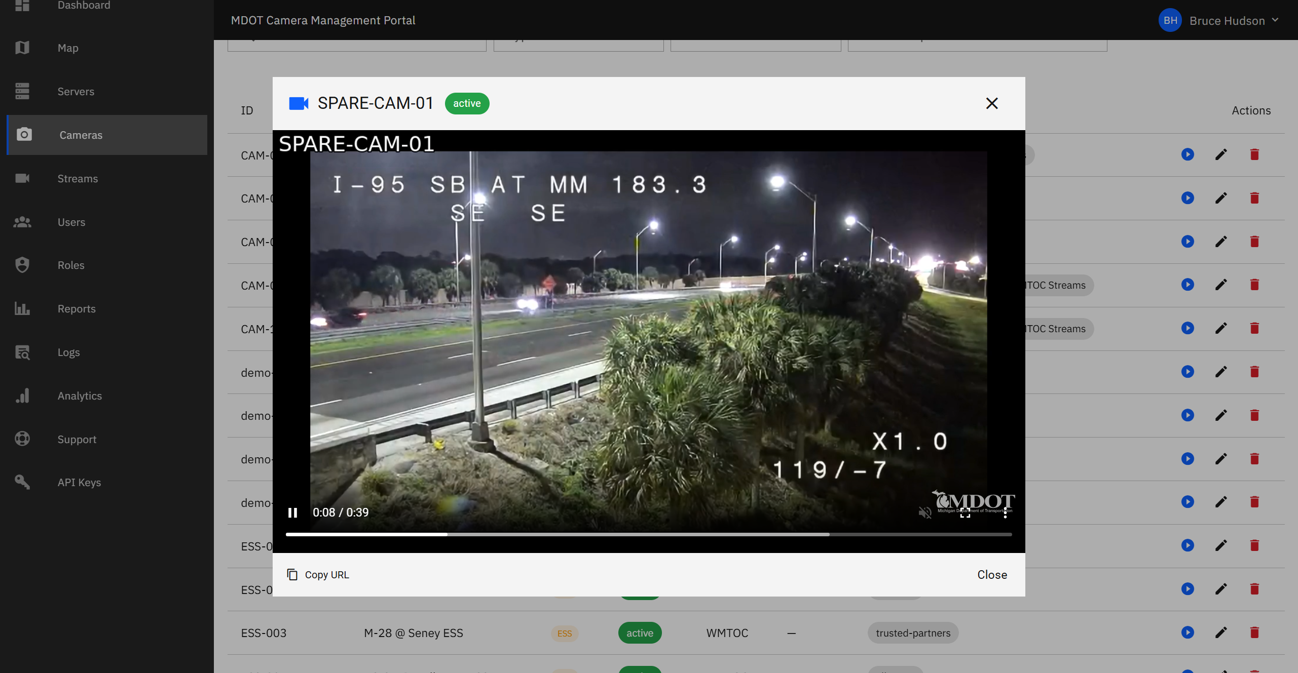 Video player window showing a live CCTV camera feed with the camera name, status, and a copy-link button.